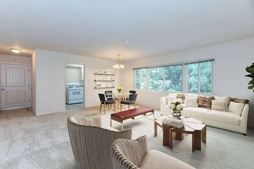 a living room with a couch and a table at Hillsdale Garden Apartments, San Mateo, CA